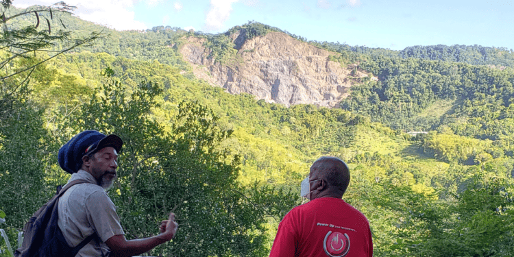 President of AVDAC, Simeon Nakhid and Vice President of MVAC, Kelvin Nakhid, observe effects of quarrying on Maracas Valley landscape